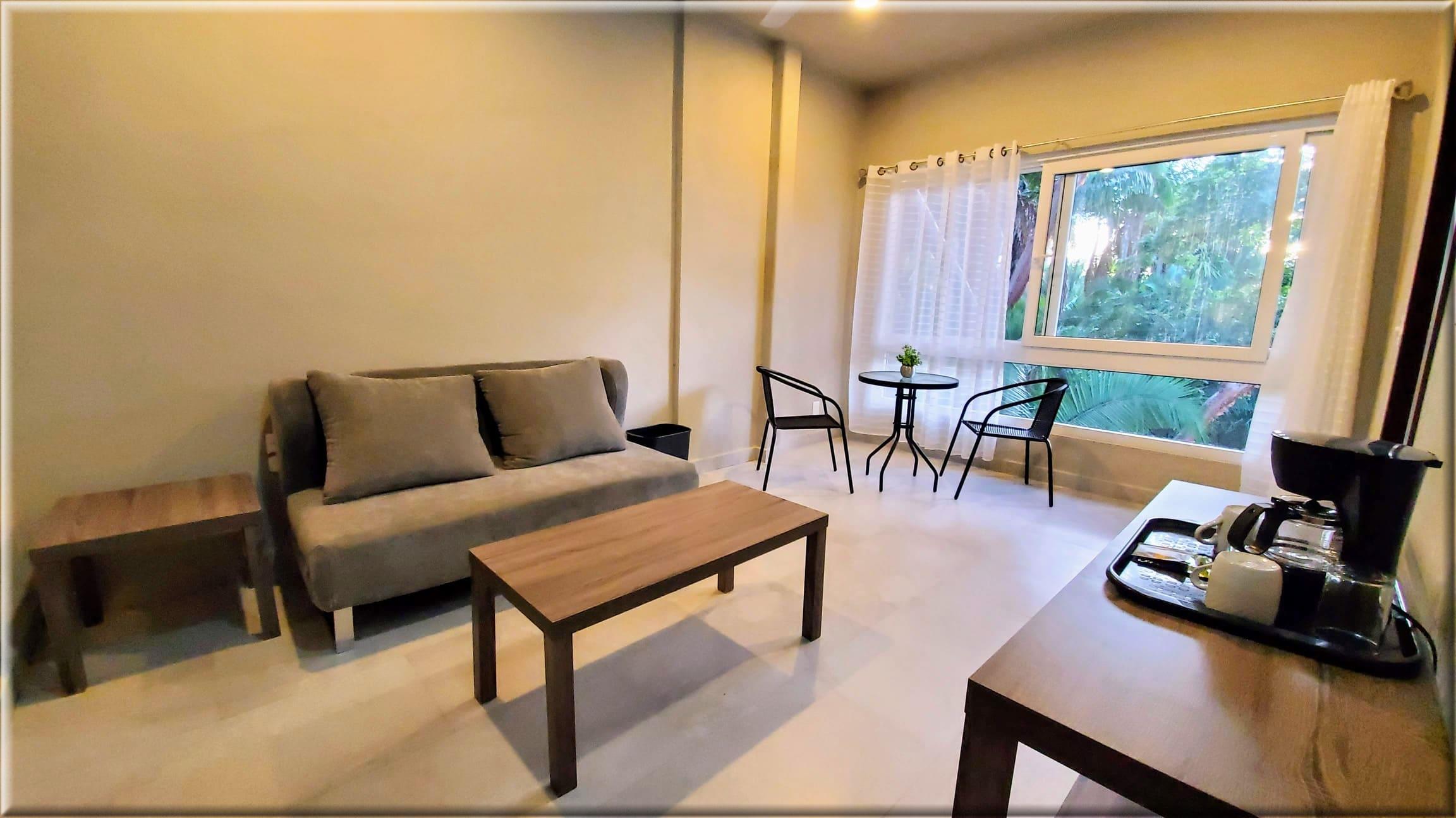 Wide-angle view of Living room Suite with jungle views